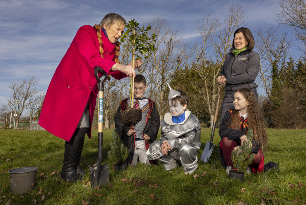 Eanna Ni Lamhna demonstarted how a tree should be planted to three children dressed as Harry Potter, the tin man and Hermione Grainger, accompanied by Coillte CEO Imelda Hurley