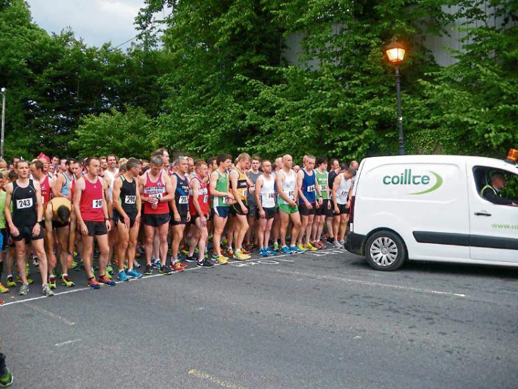 Picture of contestants lining up to start Dundrum Road Race and Coillte Van