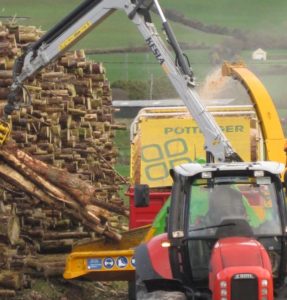 Picture of chipping machine making biomass from coillte timber