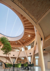 Picture of interior of wooden built office building with wooden beams, wooden roof and large skylight